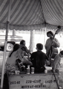 Musicians jam together in Tourist Park at an early festival.